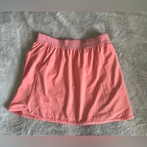 Bright pink-coral golf/tennis skirt
